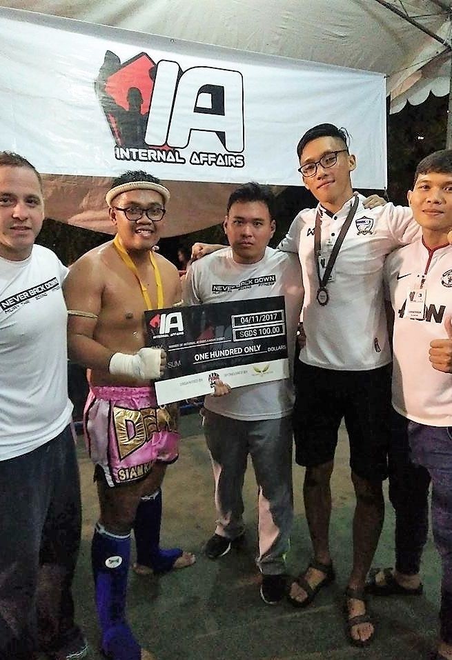 Denni Safiy (second from left) is flanked by his coaches and ring crew mates from Prime Fight Gym.