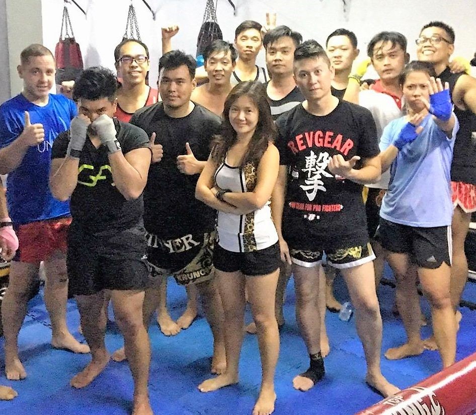 Denni (back row, first from right in glasses), trains with a multi-faceted and diverse bunch of senior, junior gym mates and coaches.