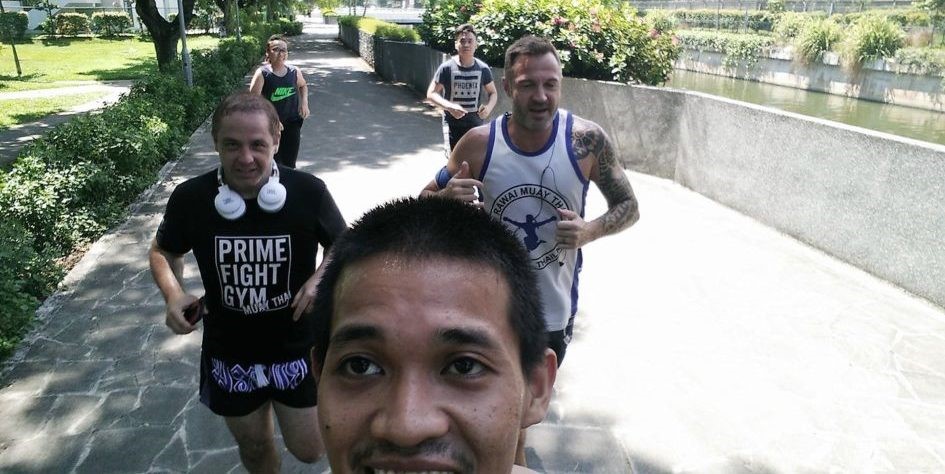 Denni's coach and Prime Fight Gym's Founder and Managing Director Mus training with Denni's fellow practitioners and trainers.