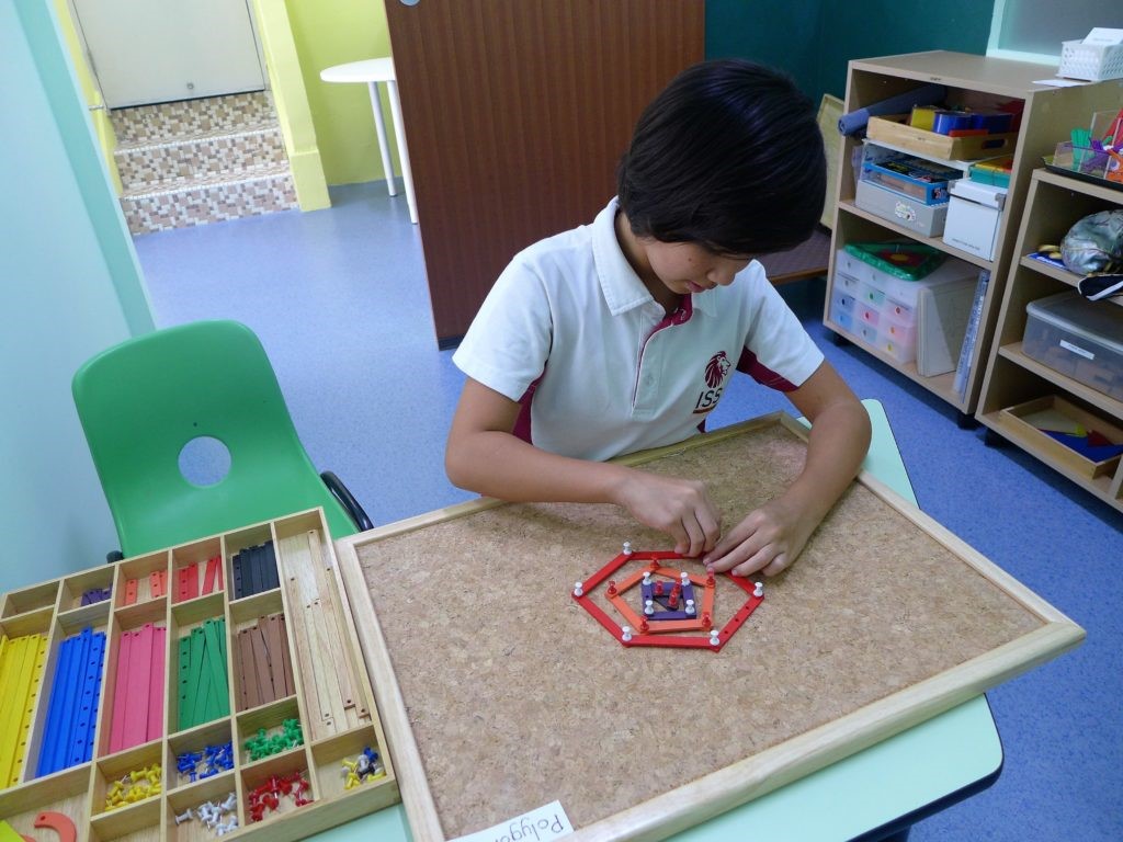Special needs child with homework that helps improve her basic pertinent skills