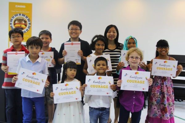 Children in Absolute Piano with their Certificates