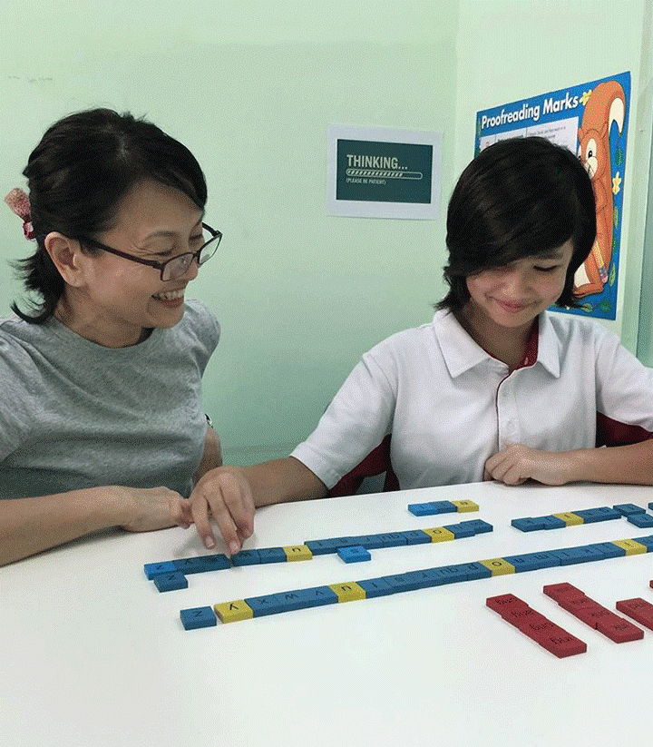 A student and her teacher in a Cognitive Connections class