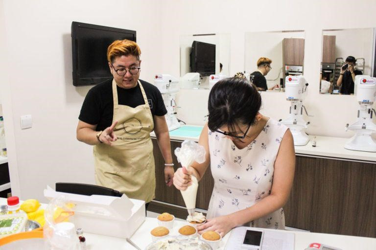 Matthew Shia teaching adult baking student